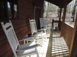 The back deck is accessed by double doors from the dining room with rockers and overlooks a private back yard.